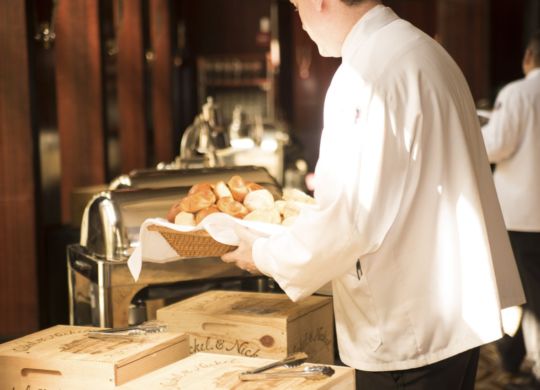 Server filling the bread pan