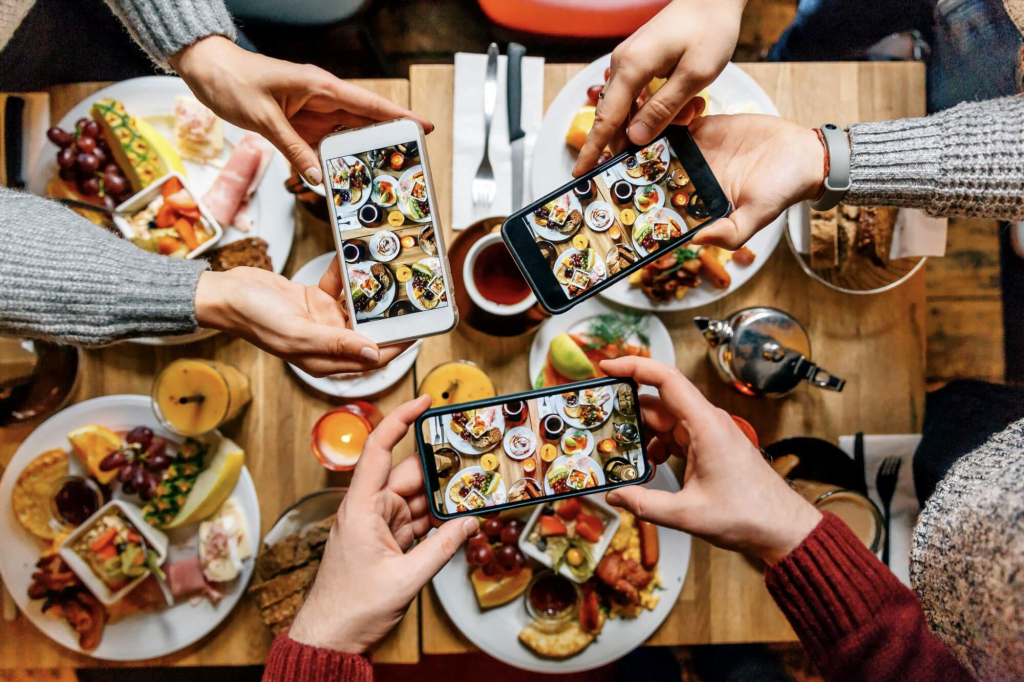 Restaurant guests taking photos of their meals